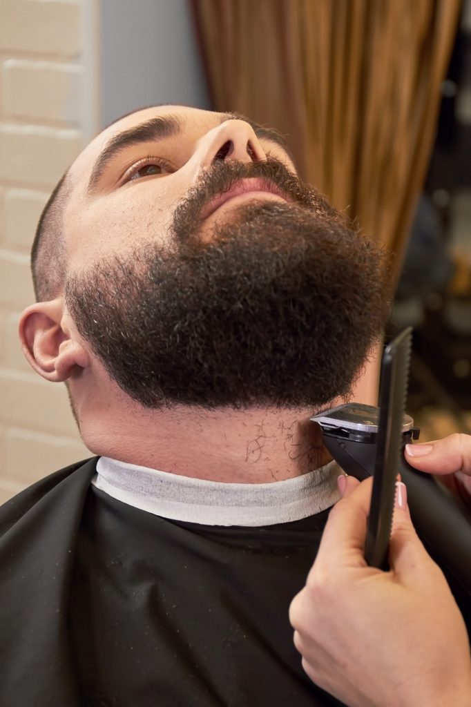 Beard trimming in barber shop